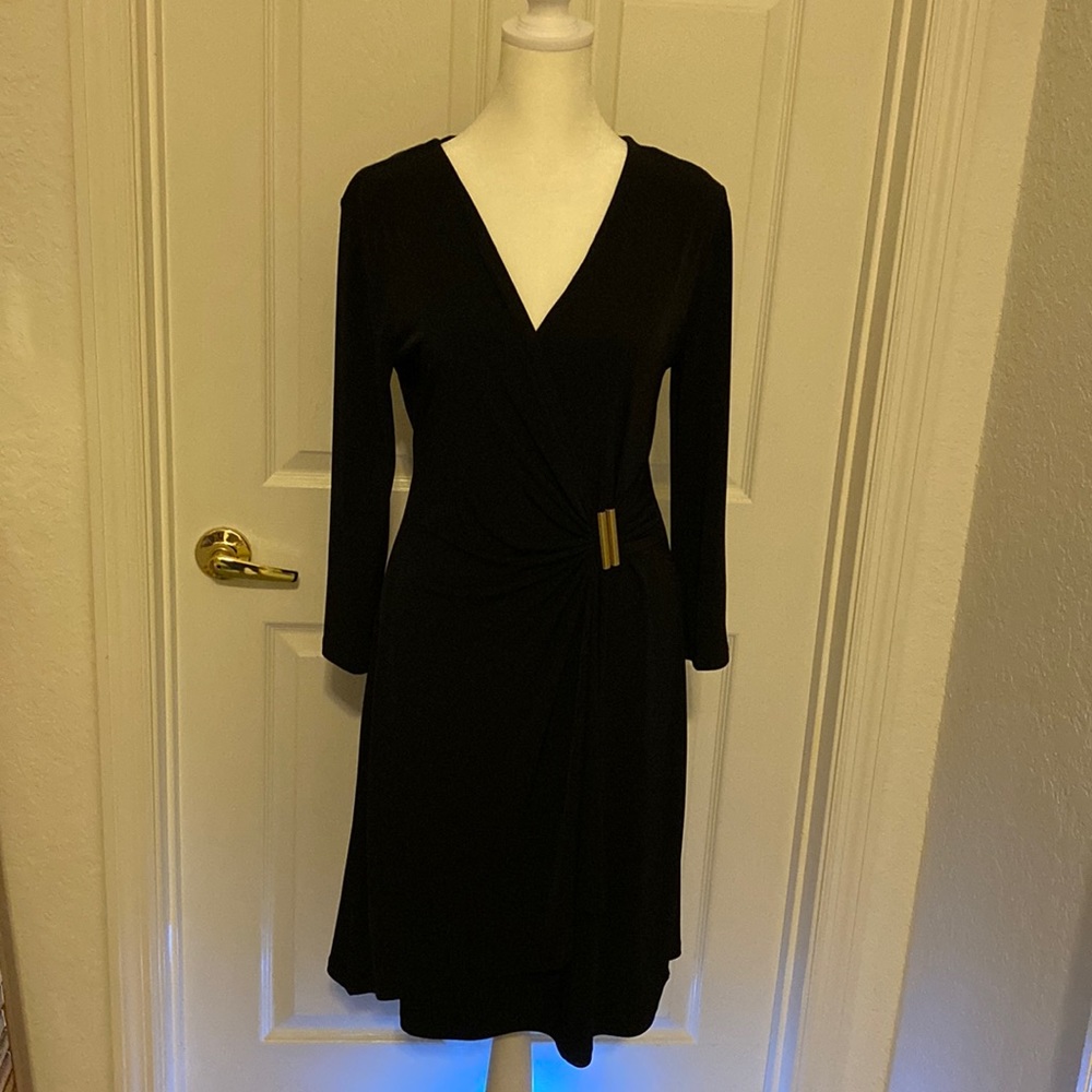 Beautiful black knee length cocktail dress. Size 8